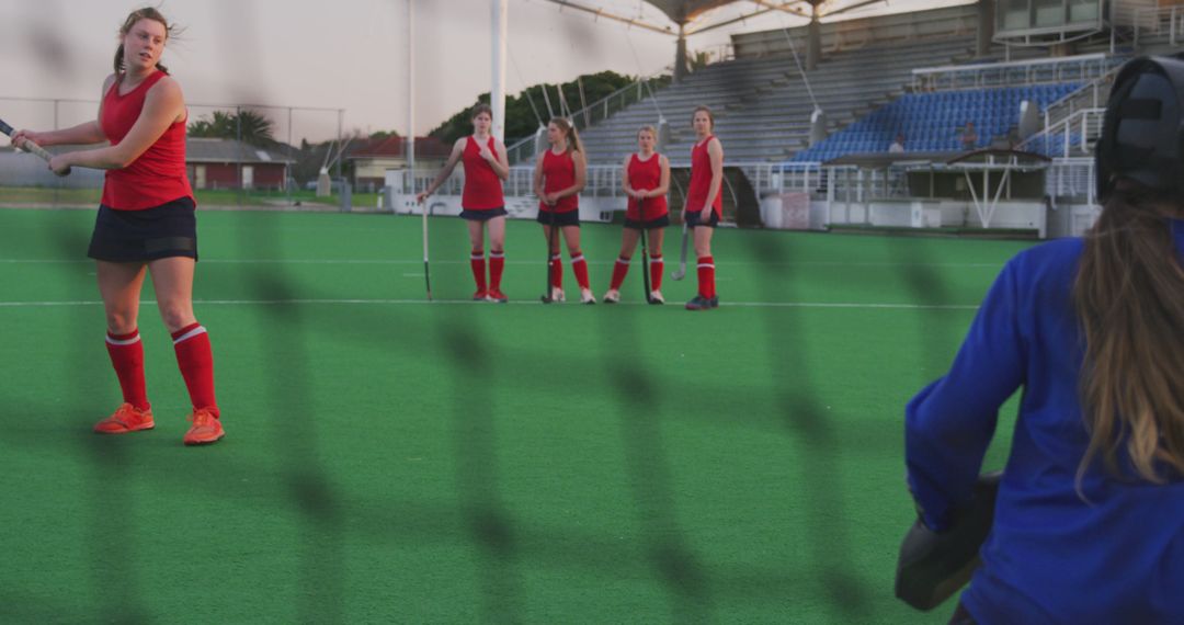 Female Field Hockey Team Practicing on Outdoor Turf Field - Free Images, Stock Photos and Pictures on Pikwizard.com