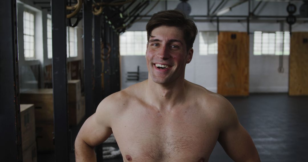 Smiling Shirtless Man Taking Break in Gym - Free Images, Stock Photos and Pictures on Pikwizard.com