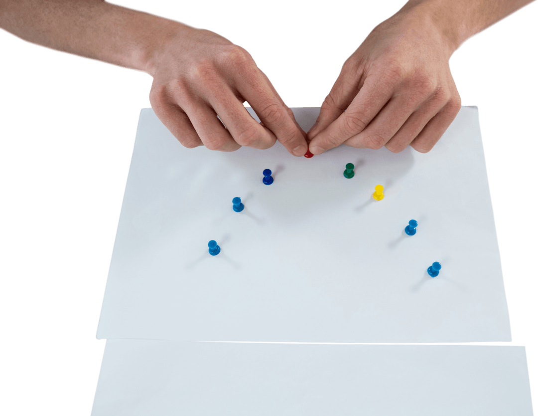 Hands Attaching Colorful Pushpins on Transparent Paper