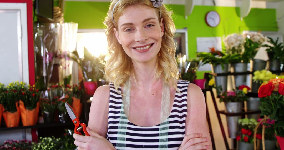 Smiling Female Florist Holding Pruning Shears in Flower Shop - Free Images, Stock Photos and Pictures on Pikwizard.com