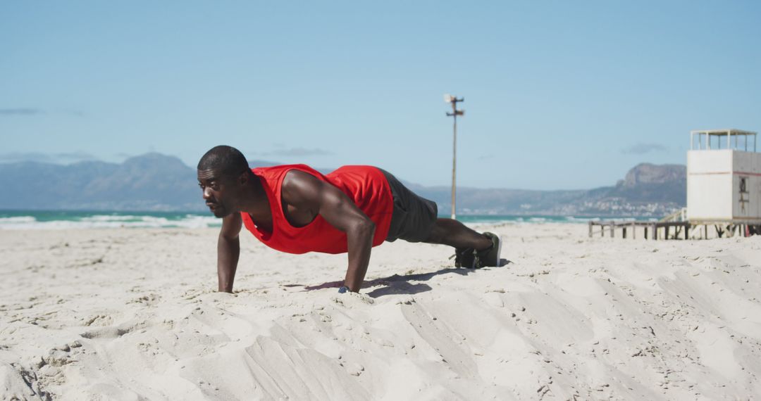 Man Performing Push-Ups on Beach for Outdoor Workout - Free Images, Stock Photos and Pictures on Pikwizard.com