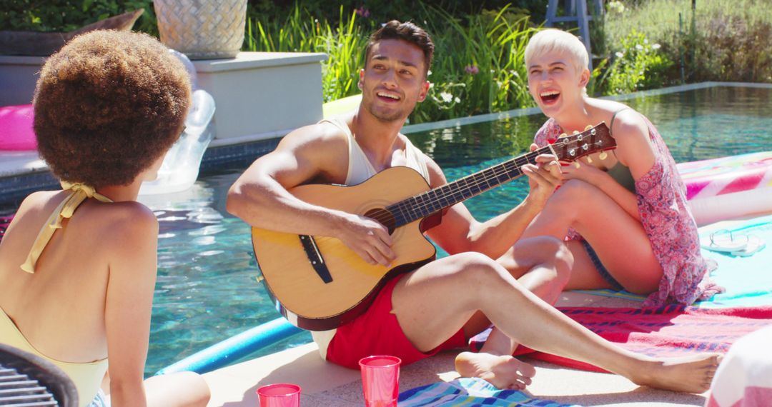 Friends Enjoying Summer Poolside with Guitar Music - Free Images, Stock Photos and Pictures on Pikwizard.com