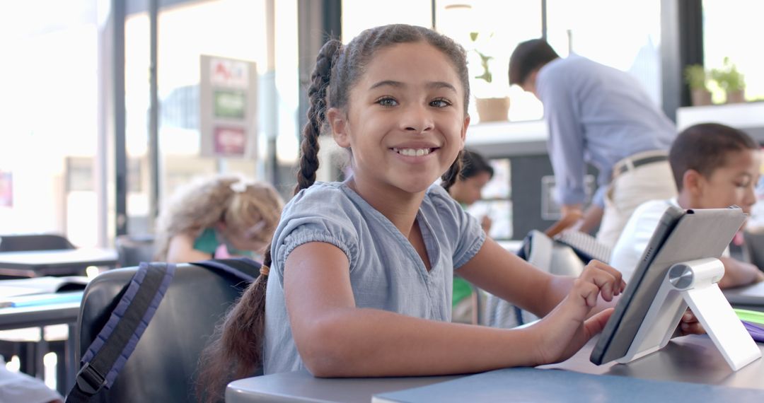 Happy Student Engaged with Learning Tablet in Classroom