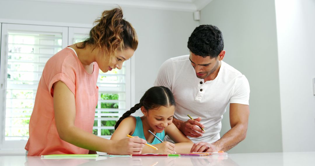 Parents Helping Daughter with Homework in Bright Kitchen - Free Images, Stock Photos and Pictures on Pikwizard.com