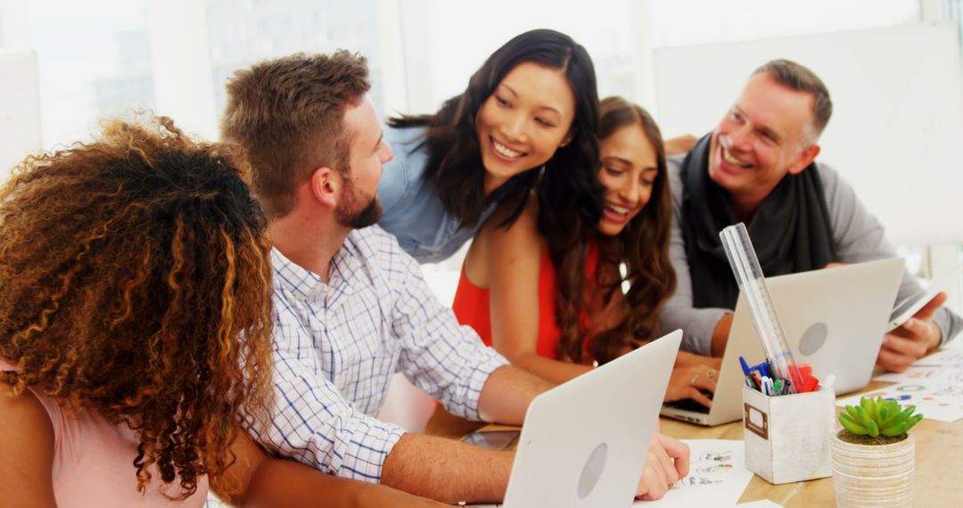 Diverse Professionals Engaging in Collaborative Teamwork in Office