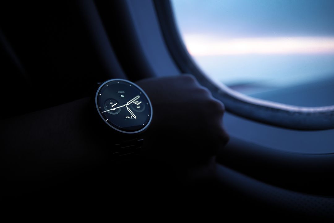 Close-up of Wristwatch Against Airplane Window During Dusk - Free Images, Stock Photos and Pictures on Pikwizard.com
