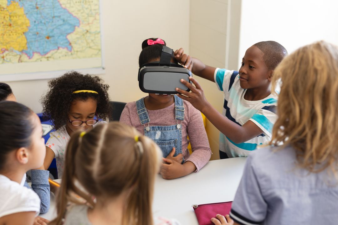 Schoolkids using virtual reality headset in classroom - Free Images, Stock Photos and Pictures on Pikwizard.com