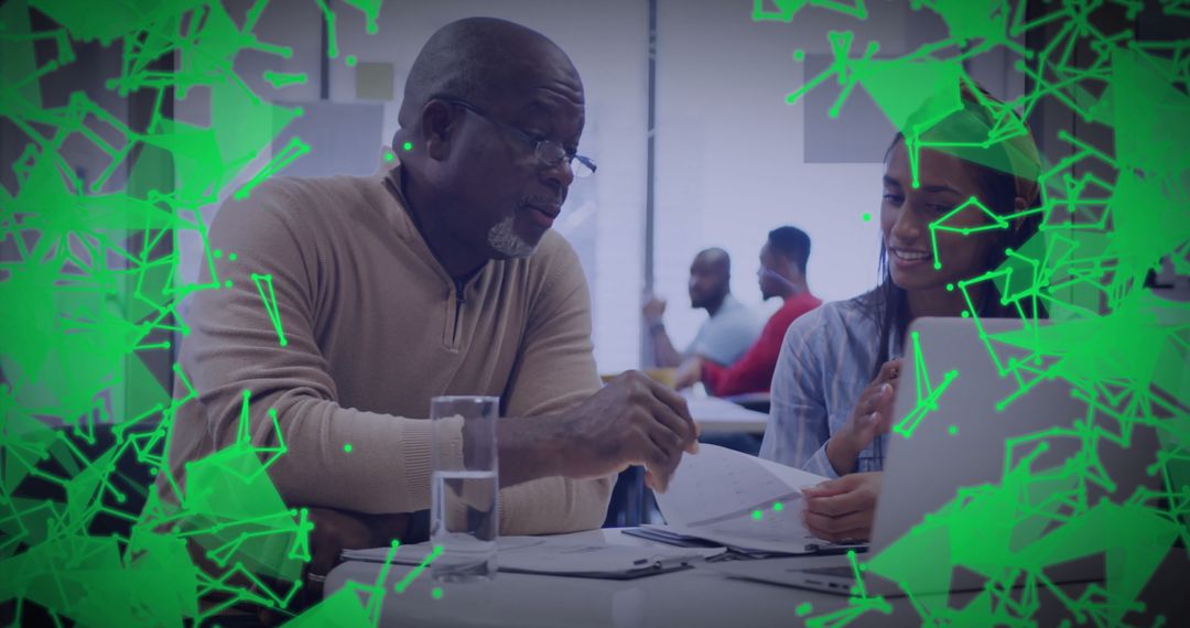 Mentor Offering Guidance in Innovative Workspace