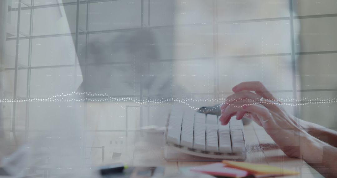 Hands Typing on White Keyboard in Modern Office Setting