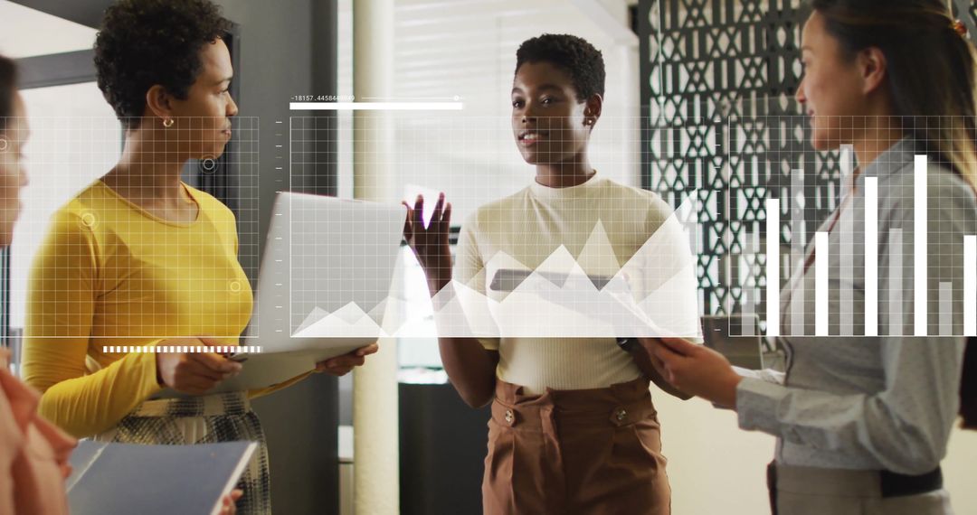 Diverse Team Analyzing Business Data in Modern Office Environment