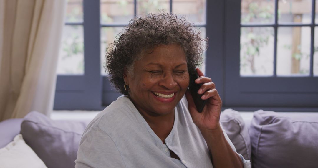 Senior Black Woman Having Phone Conversation On Couch - Free Images, Stock Photos and Pictures on Pikwizard.com