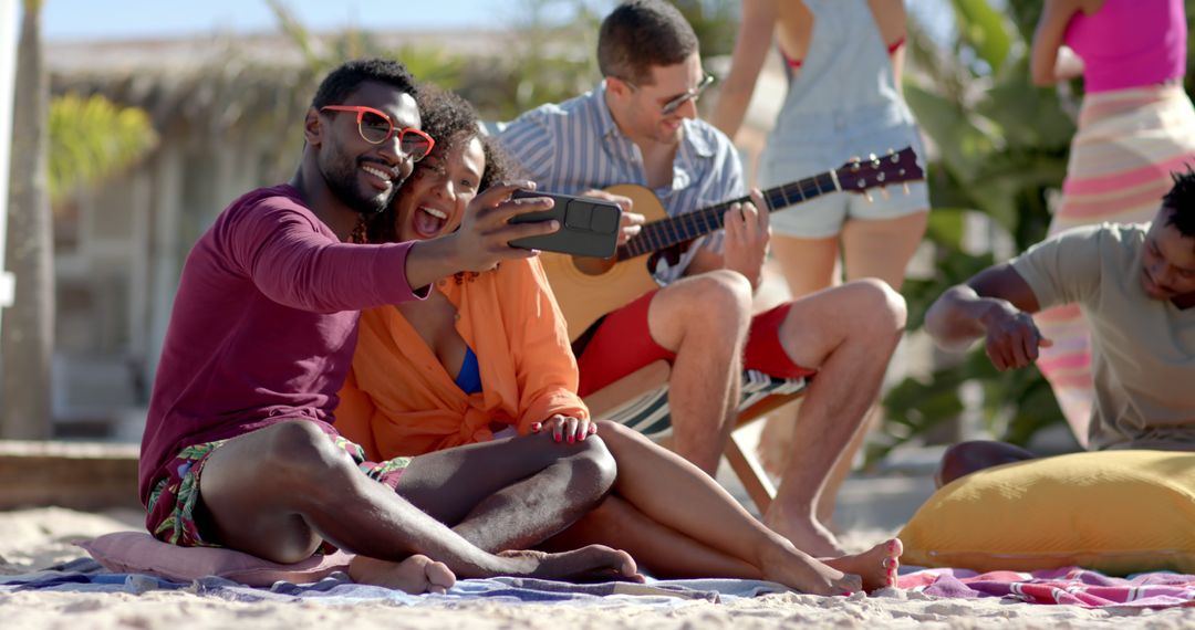 Diverse Friends Taking Selfie on Sunny Beach Day - Free Images, Stock Photos and Pictures on Pikwizard.com