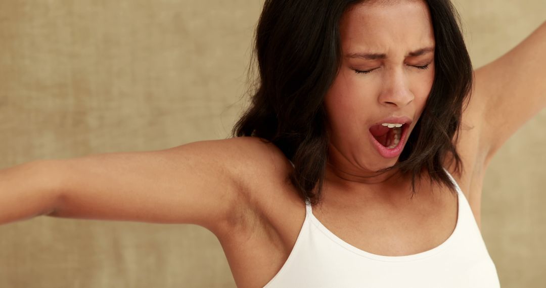 Tired Woman Stretching and Yawning in the Morning - Free Images, Stock Photos and Pictures on Pikwizard.com