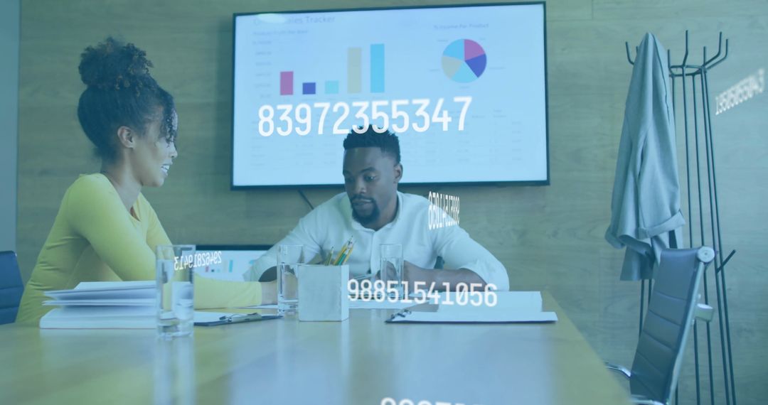 Colleagues Analyzing Digital Business Data in Modern Office