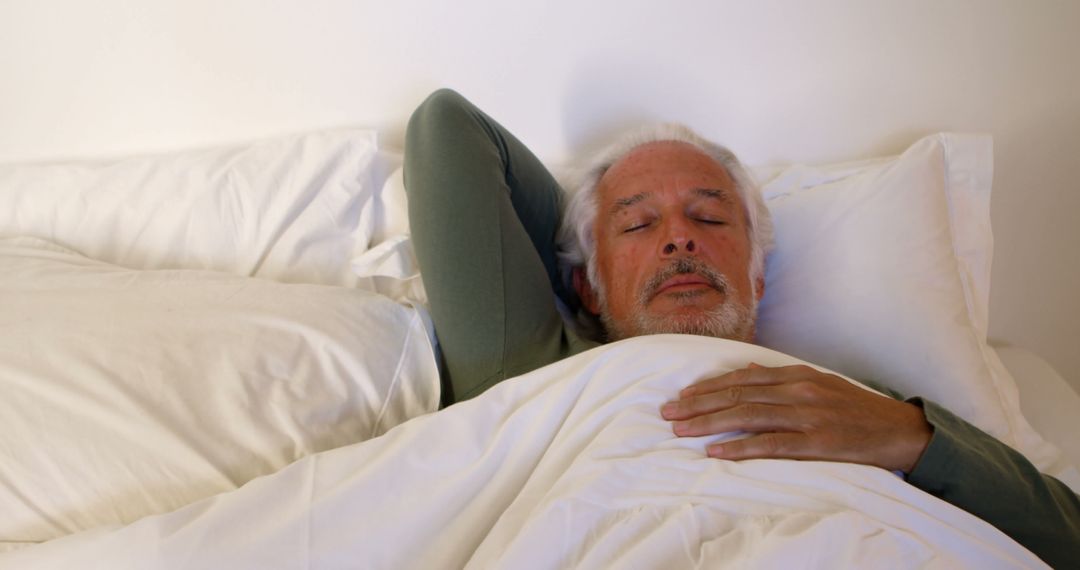 Elderly man sleeping peacefully in bed - Free Images, Stock Photos and Pictures on Pikwizard.com