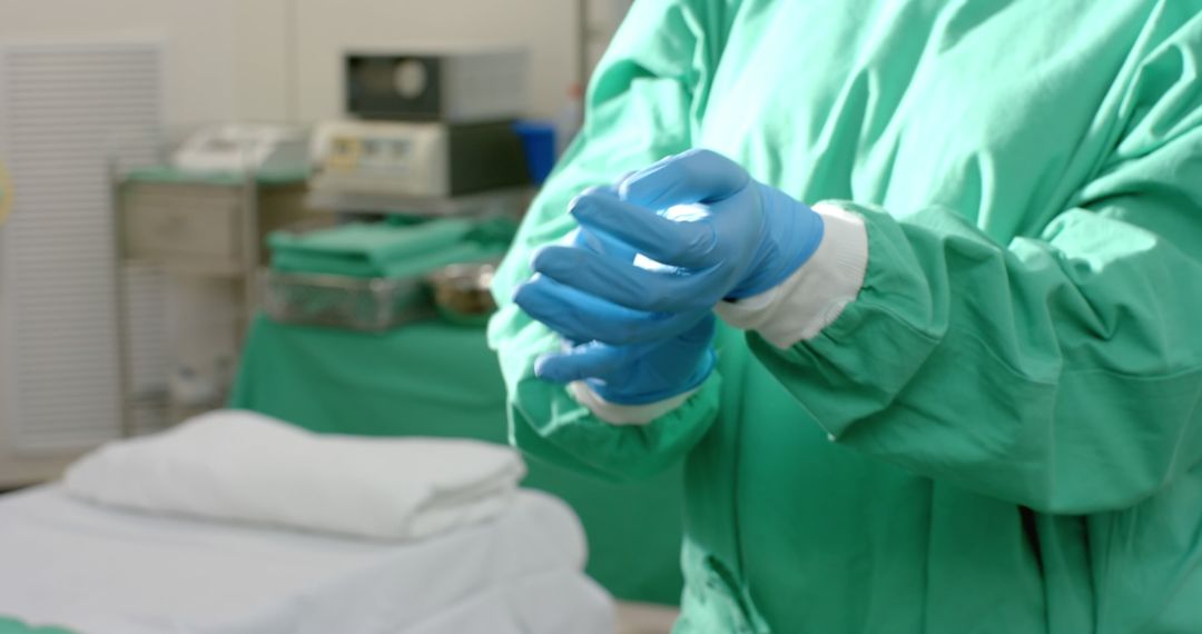 Surgeon Preparing for Surgery Wearing Protective Gear - Free Images, Stock Photos and Pictures on Pikwizard.com