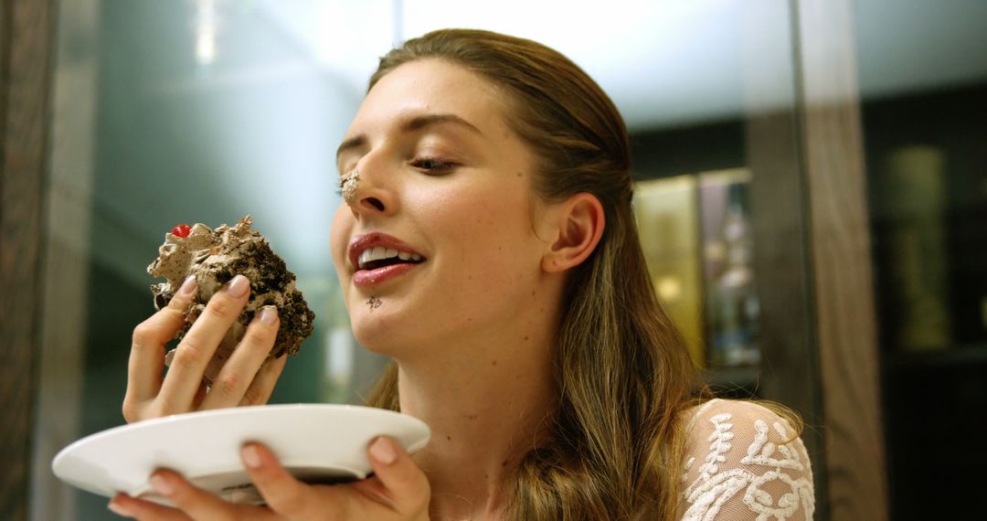 Woman Enjoying Messy Cake in Light-Hearted Moment - Free Images, Stock Photos and Pictures on Pikwizard.com