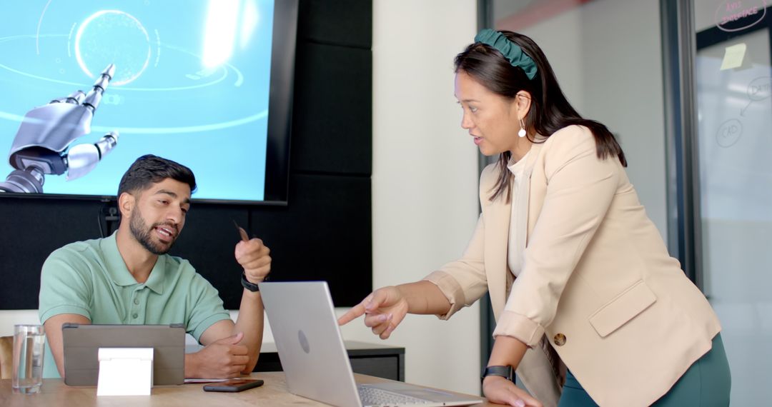 Colleagues Discussing Robotics in Modern Office Meeting