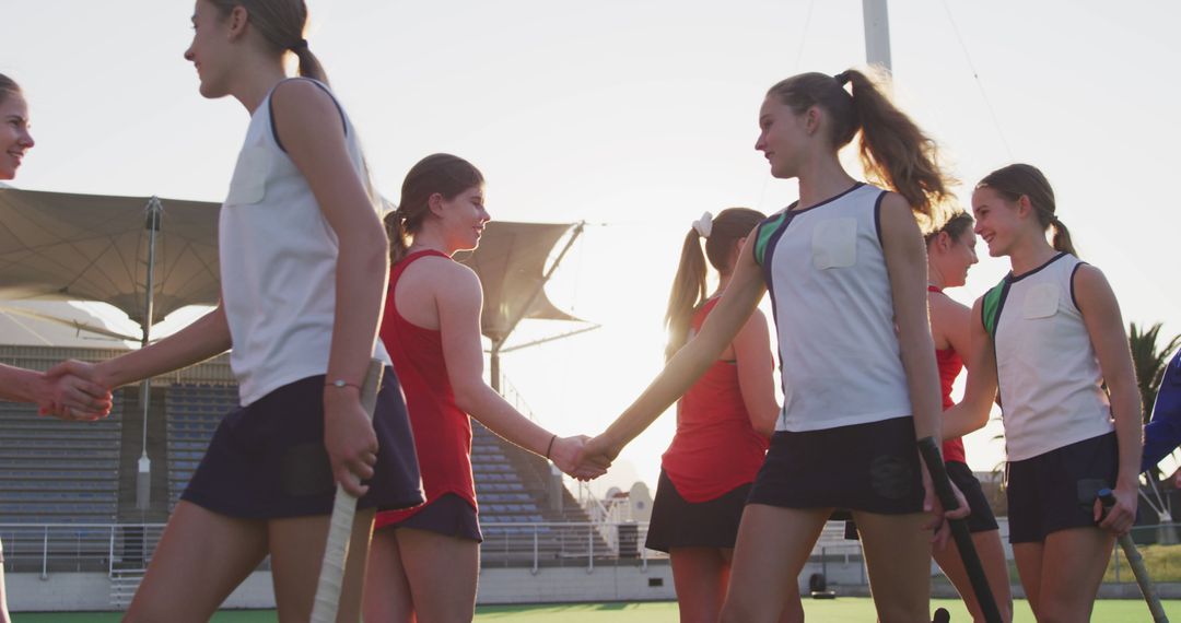 Female Field Hockey Team Celebrating Victory by Shaking Hands - Free Images, Stock Photos and Pictures on Pikwizard.com