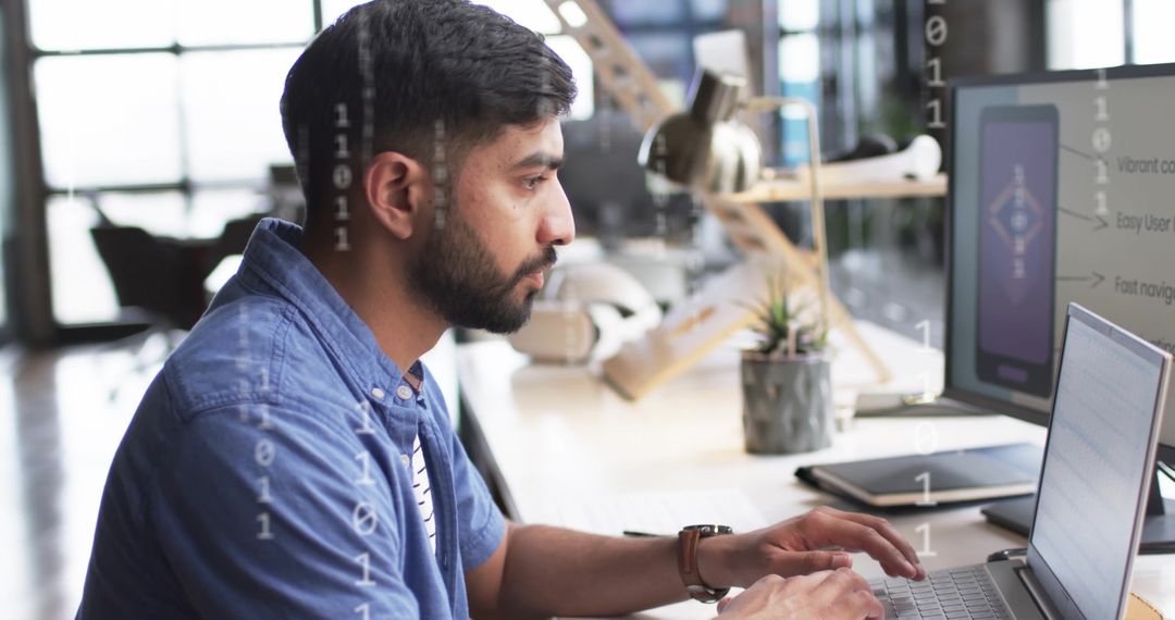 Biracial Businessman Analyzing Data on Computer in Modern Office
