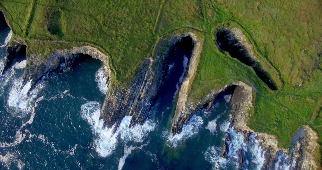 Aerial View of Rocky Coastal Cliffs with Sea Caves - Free Images, Stock Photos and Pictures on Pikwizard.com