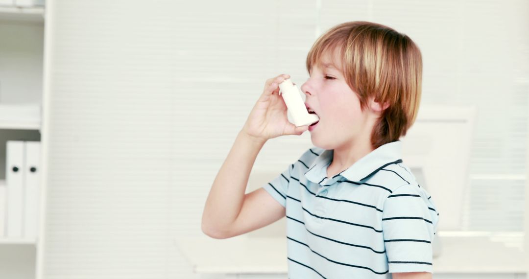 Young Boy Using Inhaler in Clinical Setting - Free Images, Stock Photos and Pictures on Pikwizard.com