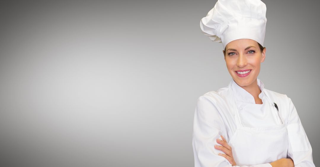 Smiling Chef Posing with Confidence Against Gray Background