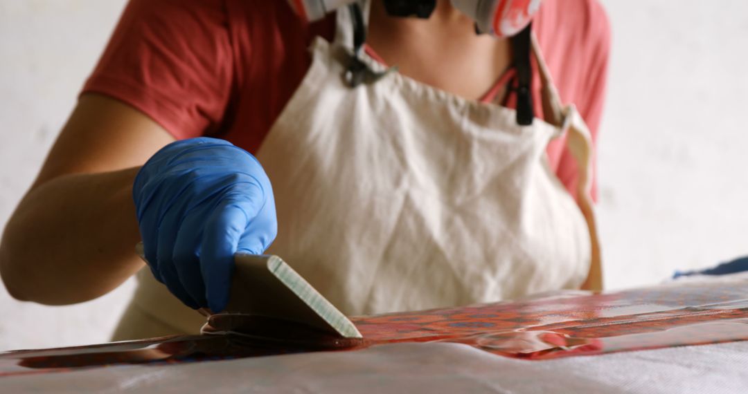 Artist Wearing Gloves and Apron Resin Coating Artwork - Free Images, Stock Photos and Pictures on Pikwizard.com