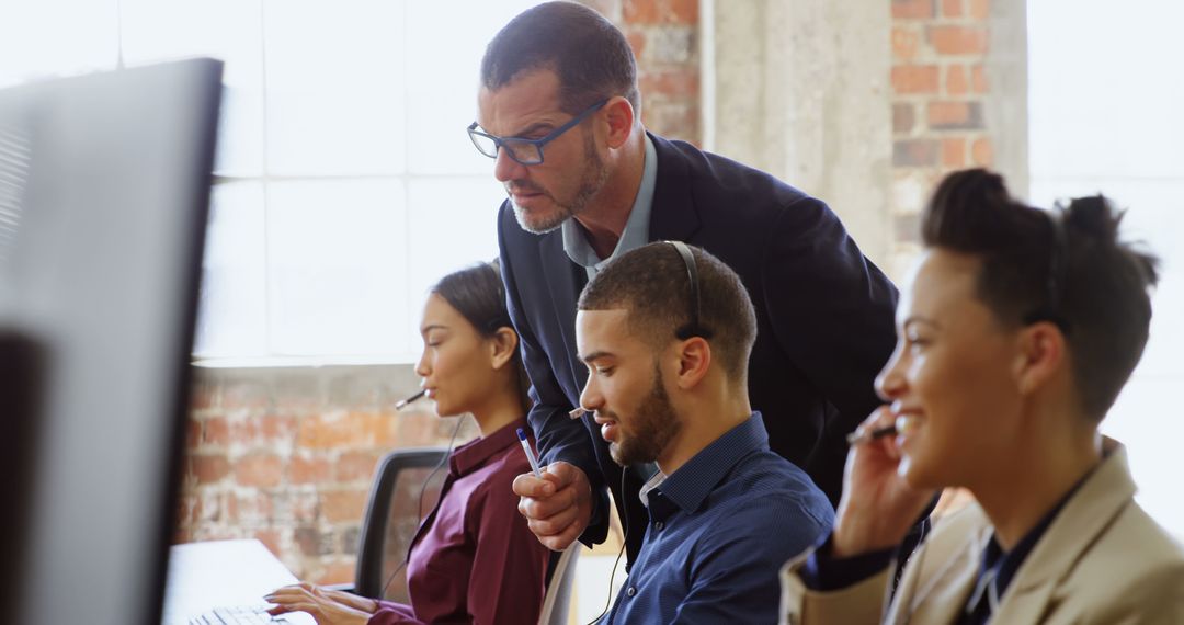 Diverse Team in Modern Office Engaging in Collaborative Work
