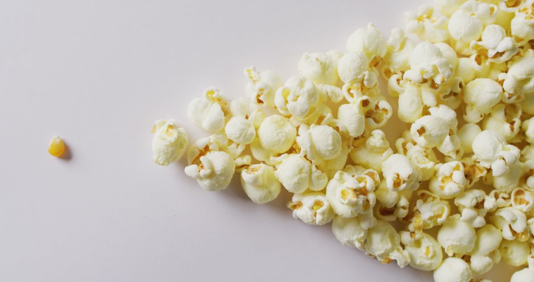 Close-Up of Popcorn Against Plain White Background - Free Images, Stock Photos and Pictures on Pikwizard.com