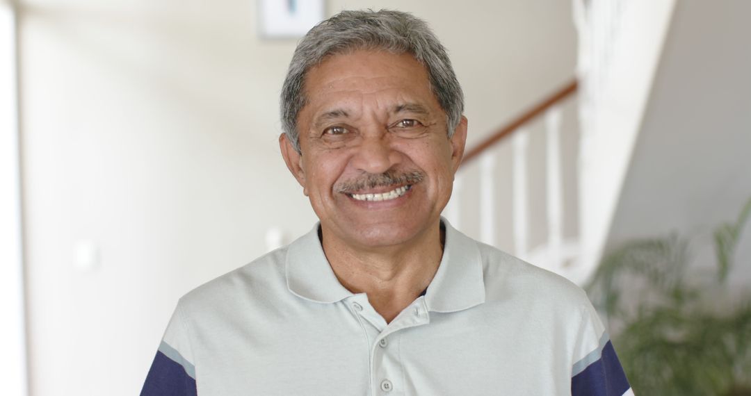 Smiling Senior Man Indoors in Casual Wear - Free Images, Stock Photos and Pictures on Pikwizard.com