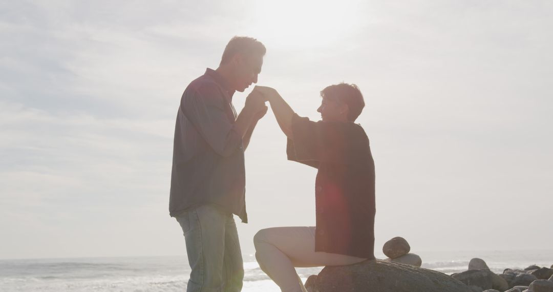 Senior Couple Sharing Romantic Moment at Sunset Beach - Free Images, Stock Photos and Pictures on Pikwizard.com