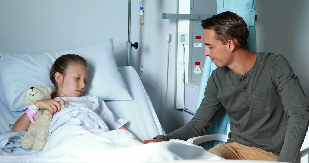 Father Comforting Young Daughter in Hospital Bed - Free Images, Stock Photos and Pictures on Pikwizard.com