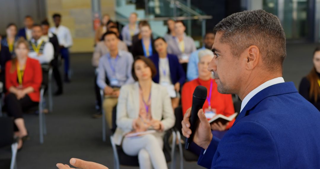 A man delivers a speech to an audience at a business seminar in 4K resolution. - Free Images, Stock Photos and Pictures on Pikwizard.com