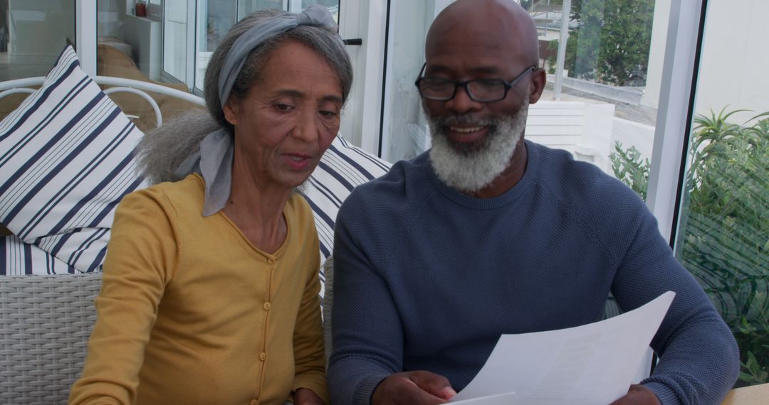 Senior Couple Reviewing Important Documents at Home