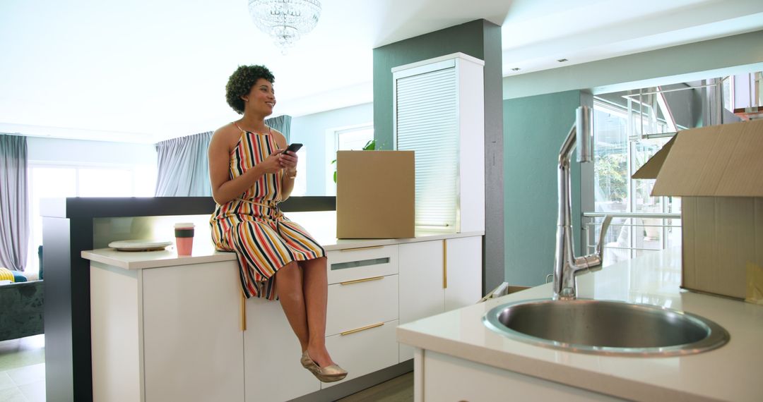 Multiracial Couple Unpacking in Modern Kitchen During Move-In