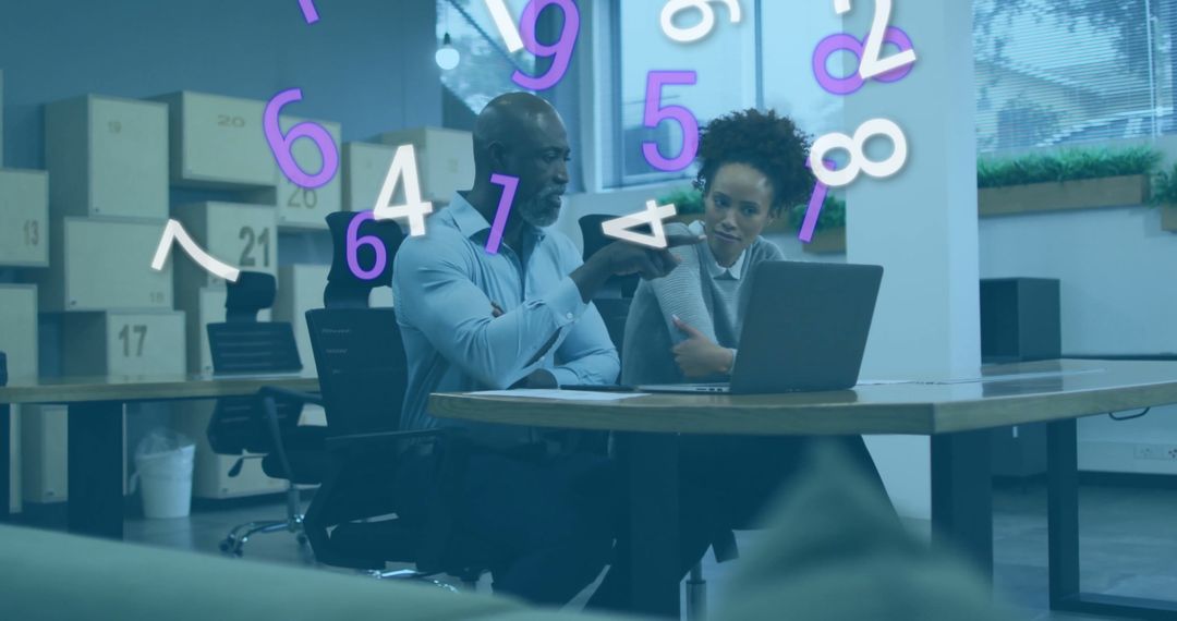 Colleagues Discussing Work with Digital Interface in Office Setting