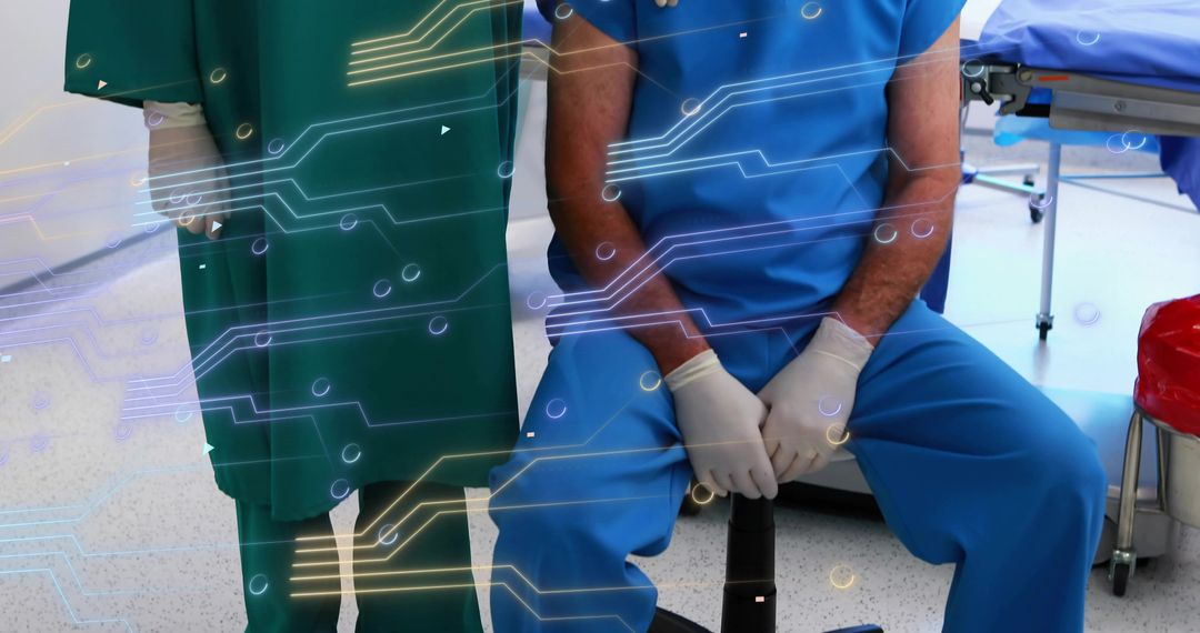 Medical team monitoring digital circuit overlay in operating room for surgical innovation