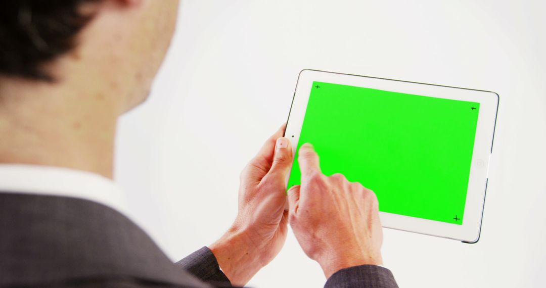 Businessman Using Tablet with Green Screen for Presentation - Free Images, Stock Photos and Pictures on Pikwizard.com