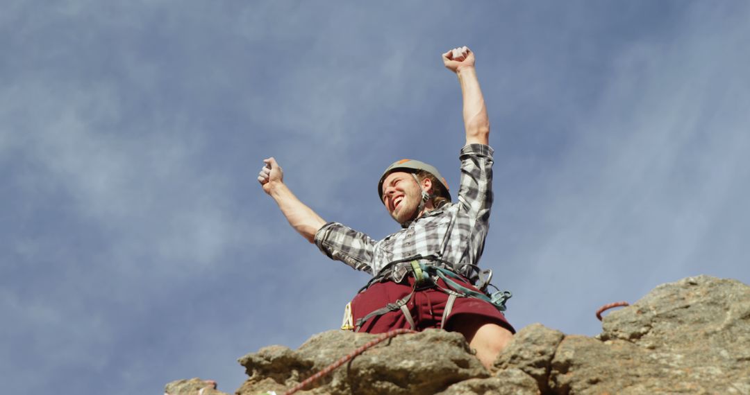 Successful Climber Celebrating on Mountain Peak - Free Images, Stock Photos and Pictures on Pikwizard.com