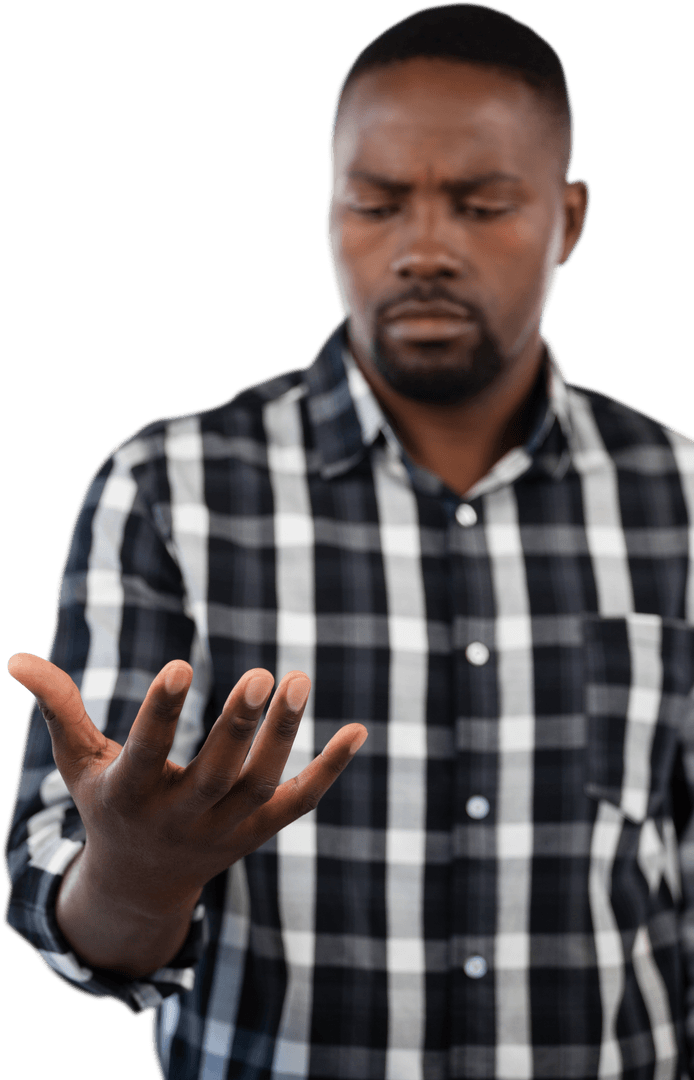 Pensive man scrutinizing hand isolated on transparent background