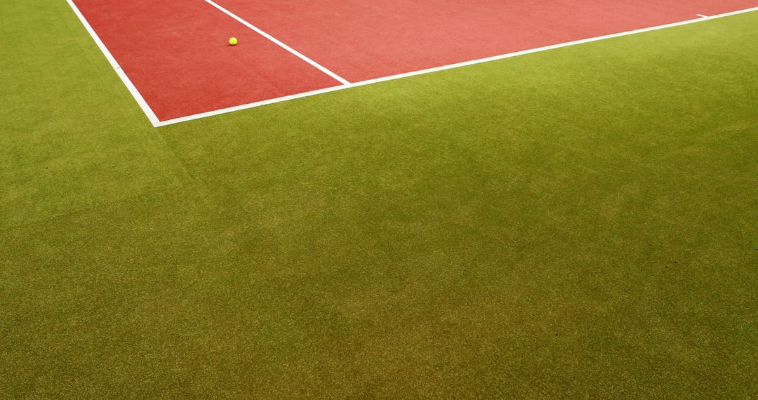 Tennis Ball on Colorful Grass Court with Red Area - Free Images, Stock Photos and Pictures on Pikwizard.com