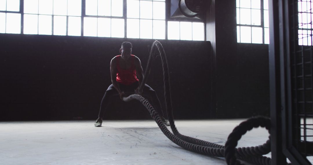 Athletic Man Intense Battle Rope Workout in Gym - Free Images, Stock Photos and Pictures on Pikwizard.com