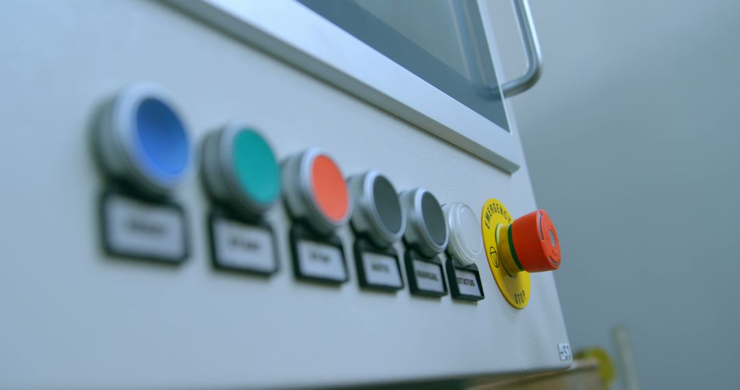 Close-Up of Industrial Control Panel With Emergency Stop Button - Free Images, Stock Photos and Pictures on Pikwizard.com