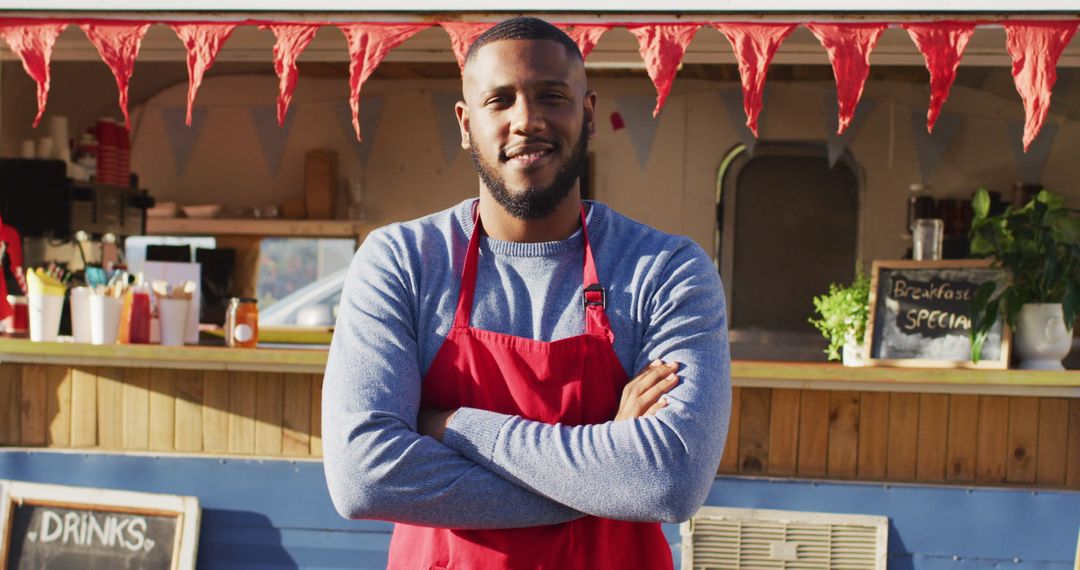 Smiling Food Truck Owner in Red Apron