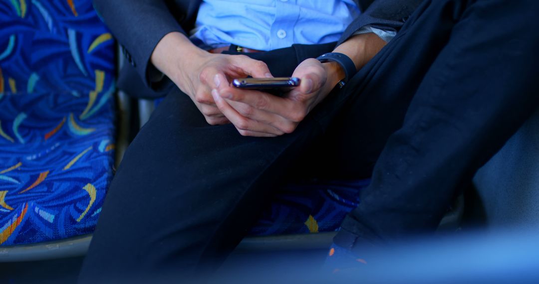 Businessman Using Smartphone While Sitting on Public Transport - Free Images, Stock Photos and Pictures on Pikwizard.com