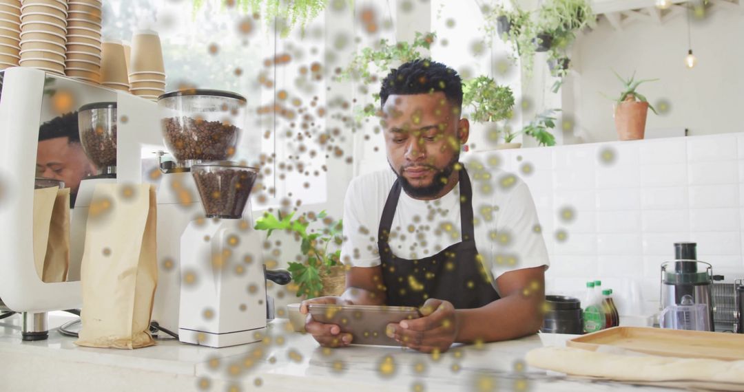Barista Using Tablet in Coffee Shop Surrounded by Floating Orbs