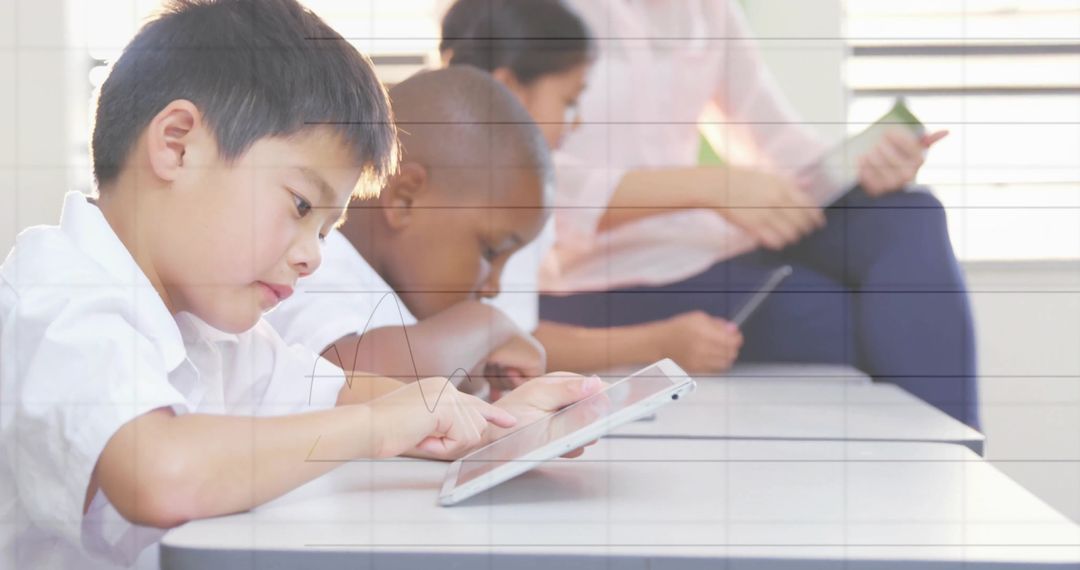 Children Using Tablets in Classroom for Interactive Learning