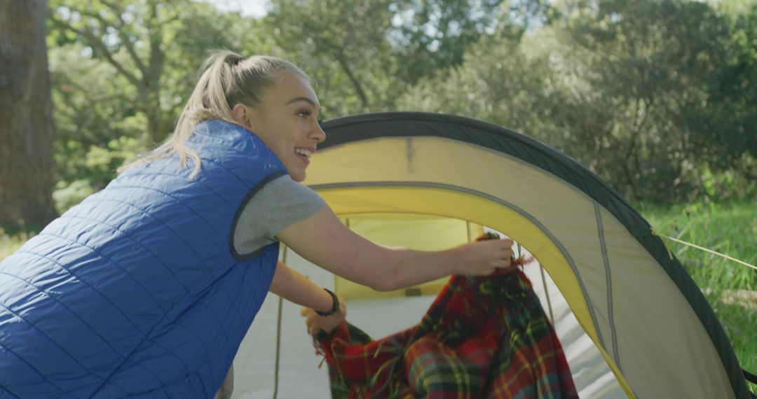 Smiling Woman Enjoying Camping in Green Forest - Free Images, Stock Photos and Pictures on Pikwizard.com