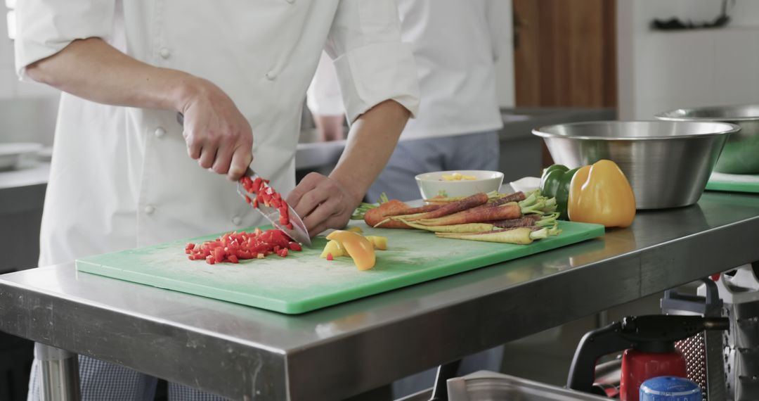 Chef Preparing Vegetables for Meals in Industrial Kitchen Setting - Free Images, Stock Photos and Pictures on Pikwizard.com